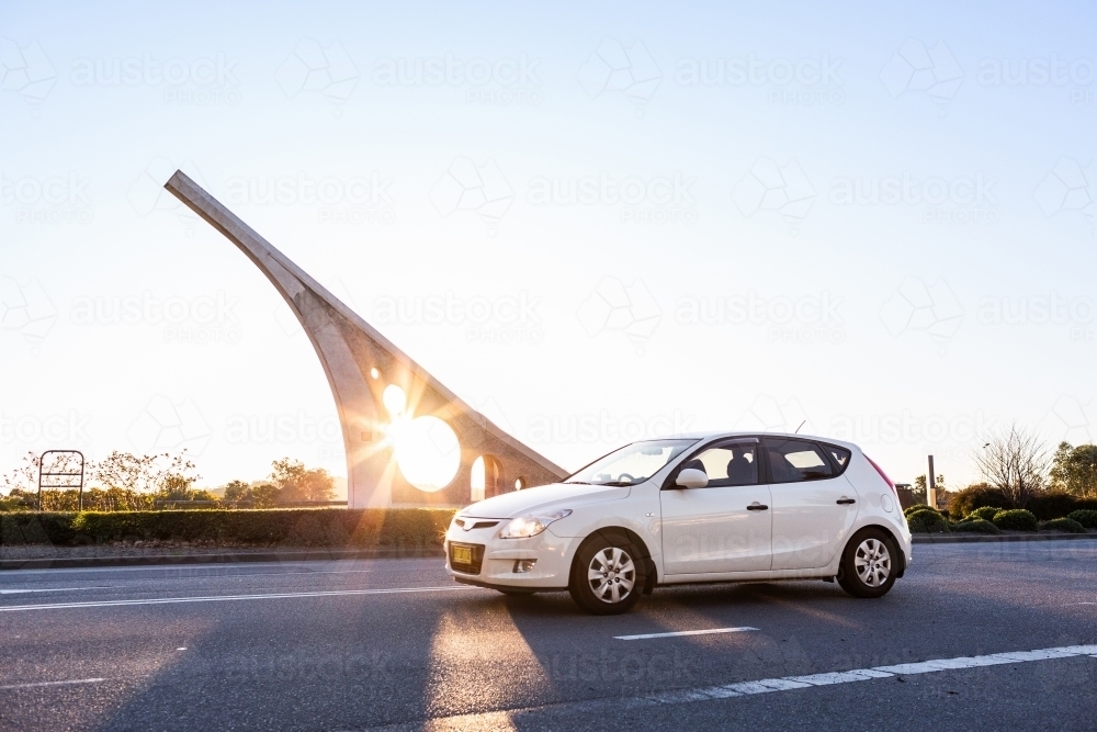 white car driving past sundial in Singleton Hunter Valley - Australian Stock Image
