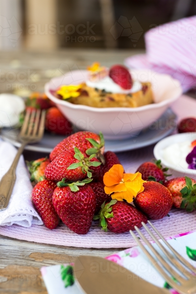 white chocolate blondie with fresh strawberries, focus on the strawberries - Australian Stock Image