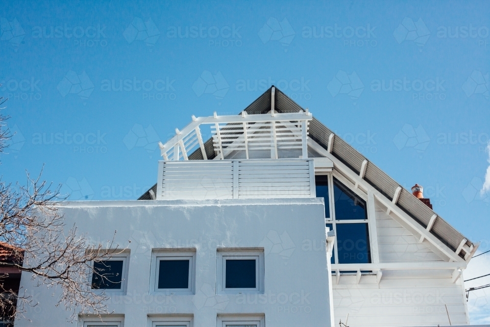 White home in front of blue sky - Australian Stock Image