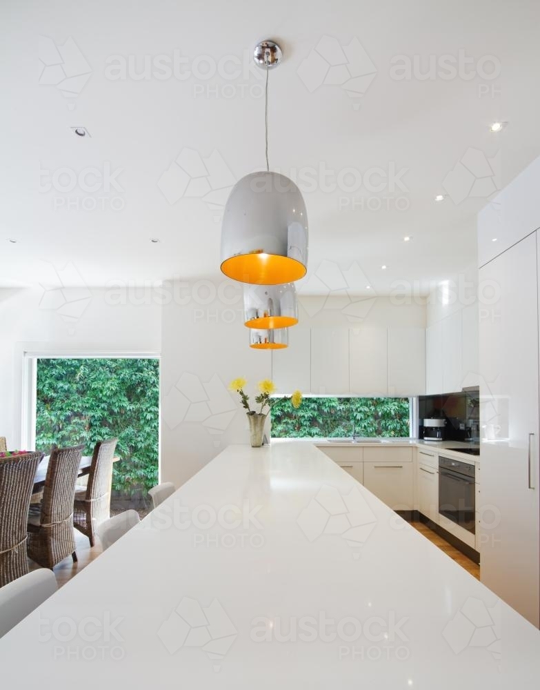 White kitchen island bench in contemporary kitchen - Australian Stock Image