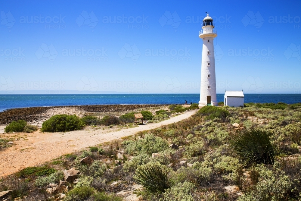 White lighthouse against a blue sky - Australian Stock Image