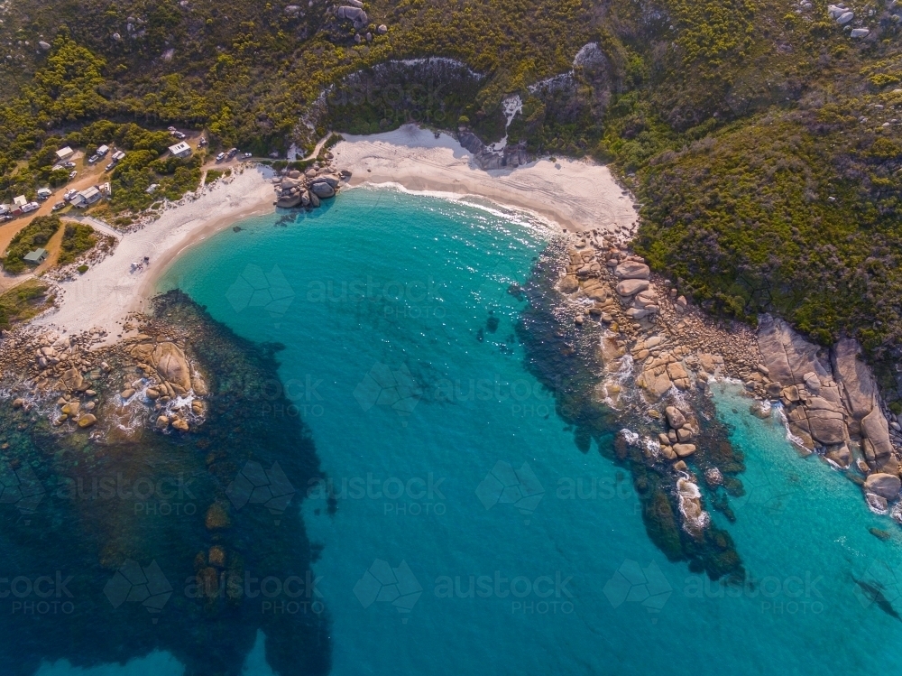 white sand beach and turquoise water in protected cove - Australian Stock Image