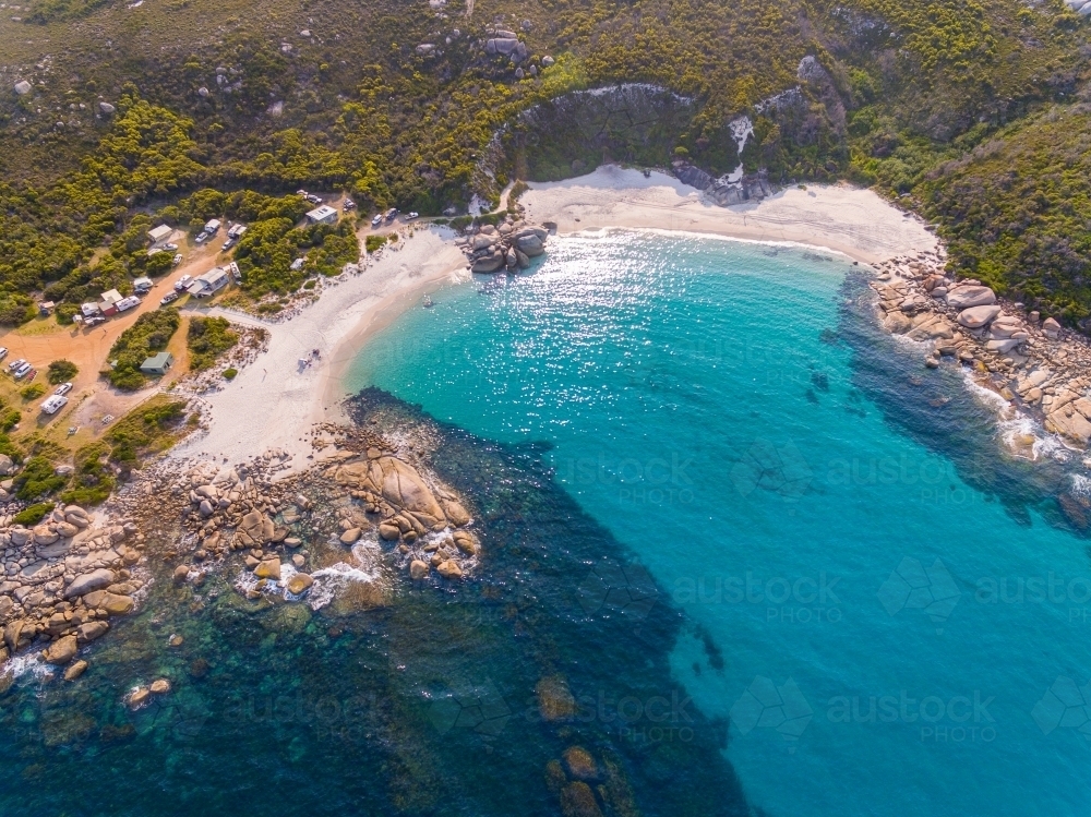 white sand beach and turquoise water in protected cove - Australian Stock Image
