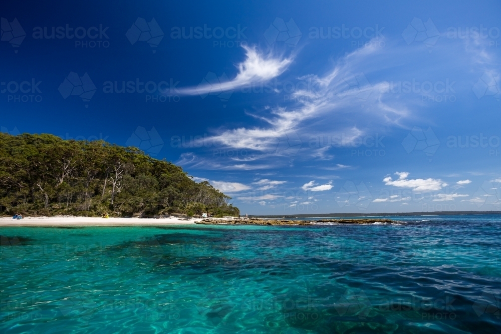 White sand beach viewed from the water - Australian Stock Image