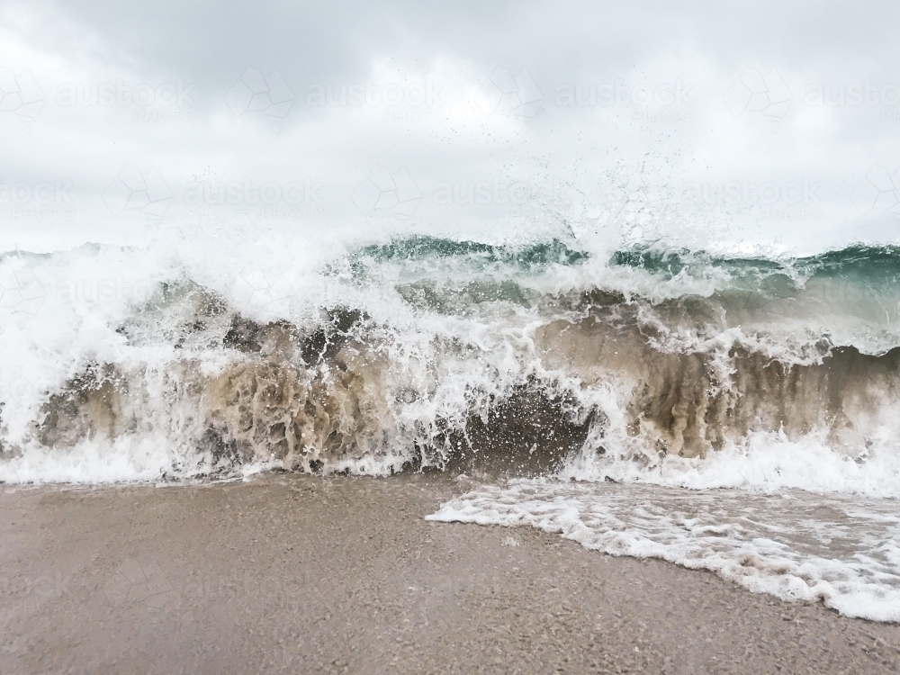 Whitewash waves crashing on the shore - Australian Stock Image