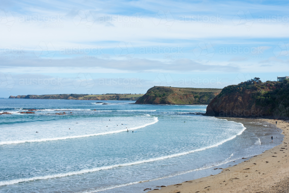 Wide shot of surf beach and cliffs - Australian Stock Image