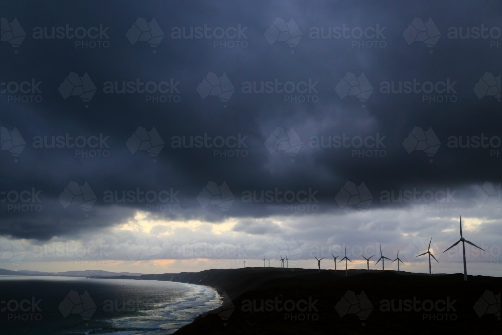 Wind turbine farm under a stormy sky at Albany, Western Australia. - Australian Stock Image