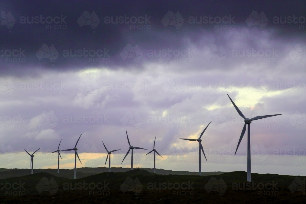 Wind turbine farm under a stormy sky at Albany, Western Australia. - Australian Stock Image