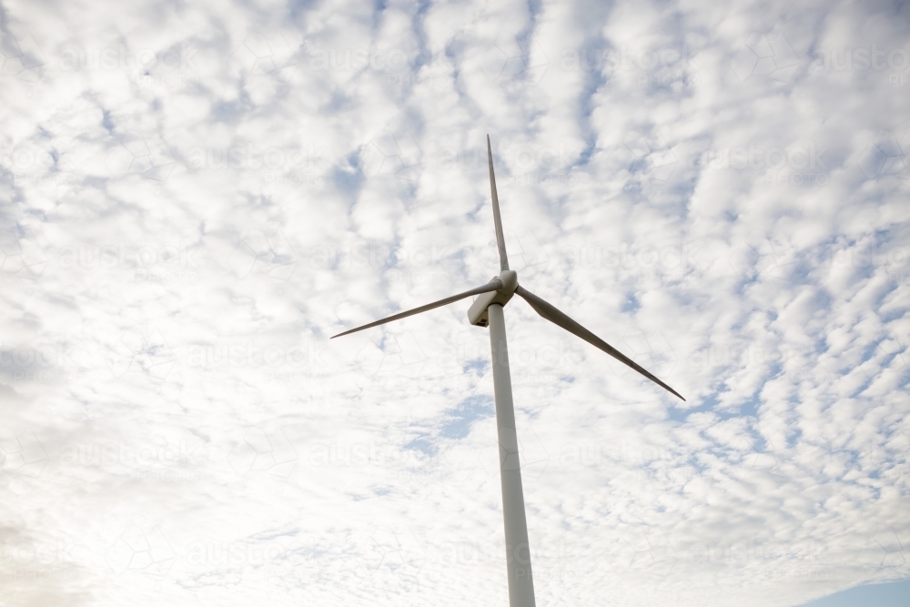wind turbine with clouds in back ground - Australian Stock Image