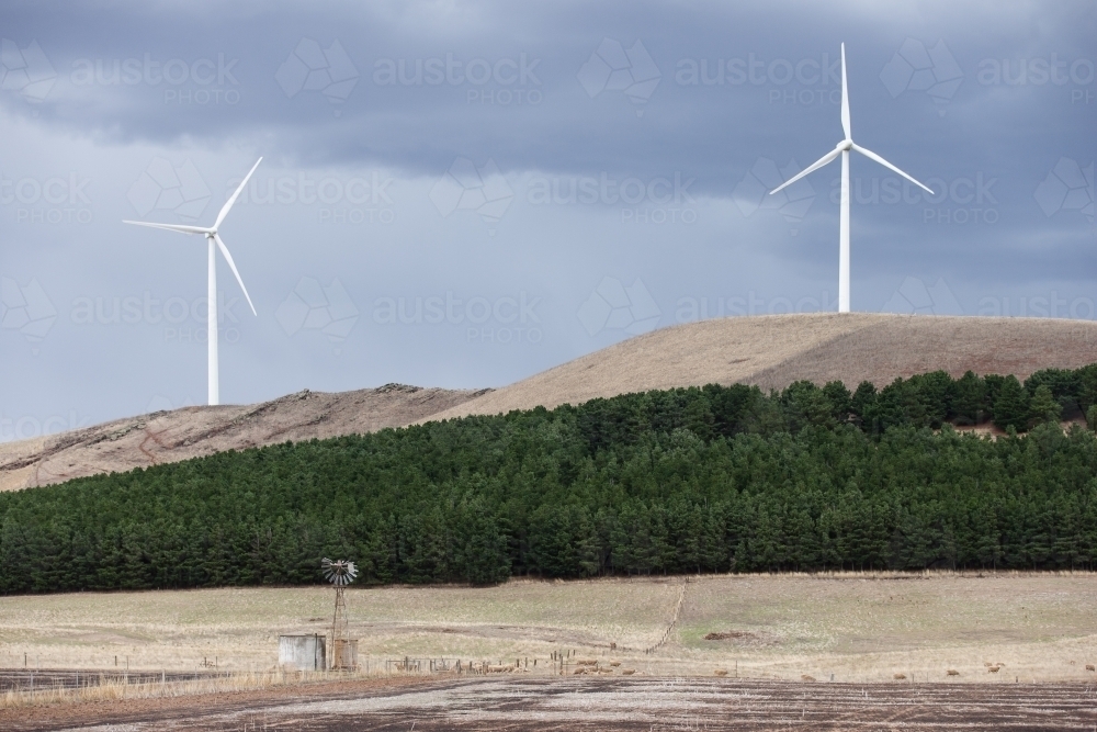 Wind turbines with windmill in foreground - Australian Stock Image