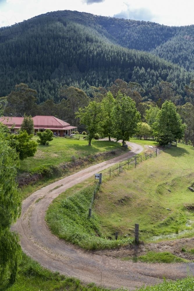 Winding drive to high country home among hills - Australian Stock Image