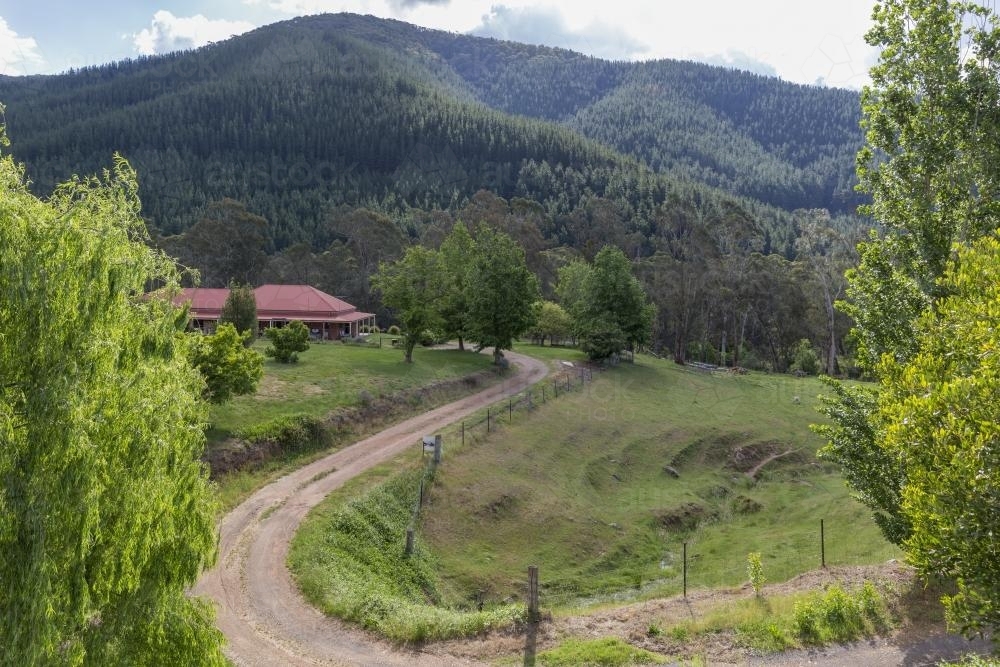Winding drive to high country home among hills - Australian Stock Image