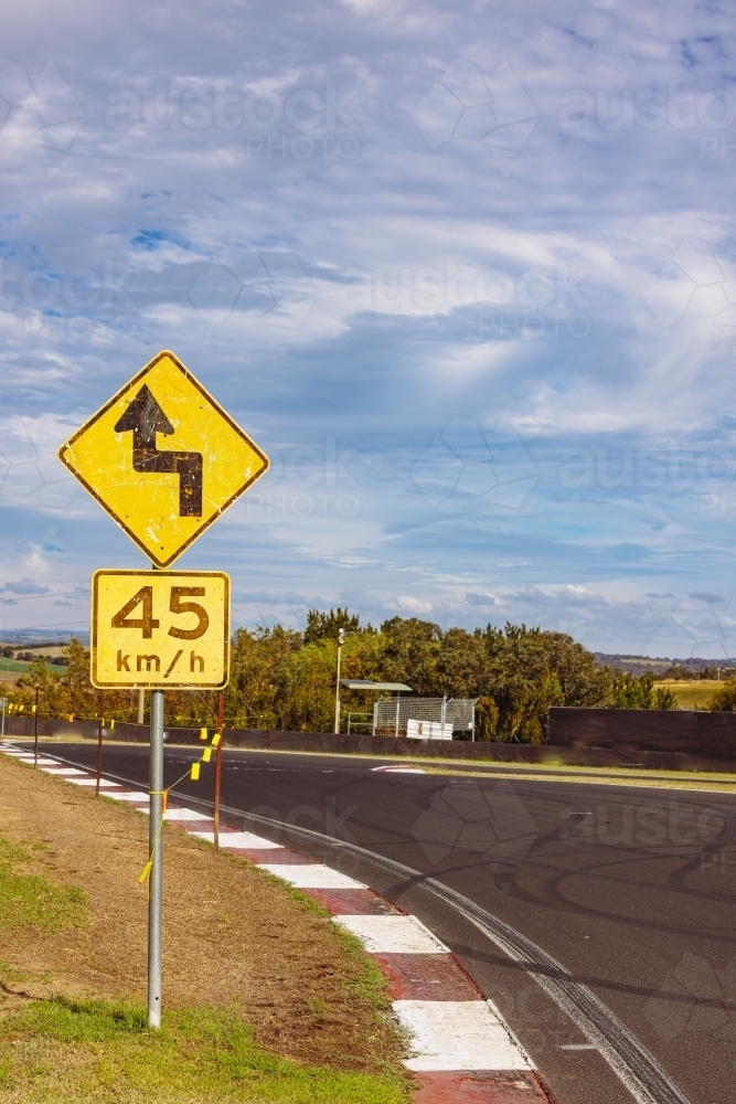 Racing Car Warning Sign Image of Winding road warning sign on the Mount Panorama racing circuit ...