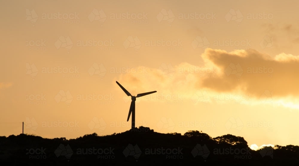 Windmill silhouette at sunset - Australian Stock Image