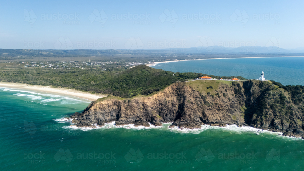 Windswept headland above rugged coastline with steep cliffs - Australian Stock Image