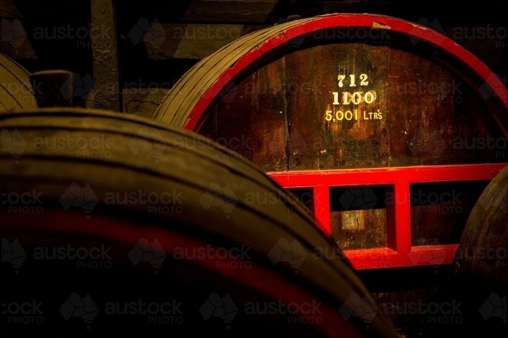 Wine barrel in dark cellar - Australian Stock Image