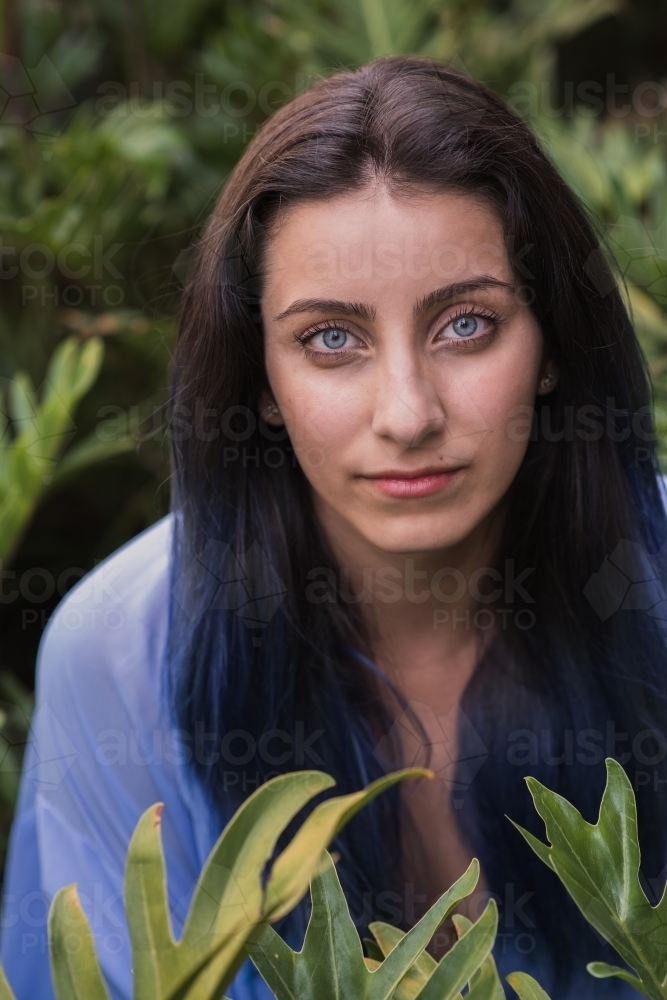 woman amongst leaves - Australian Stock Image