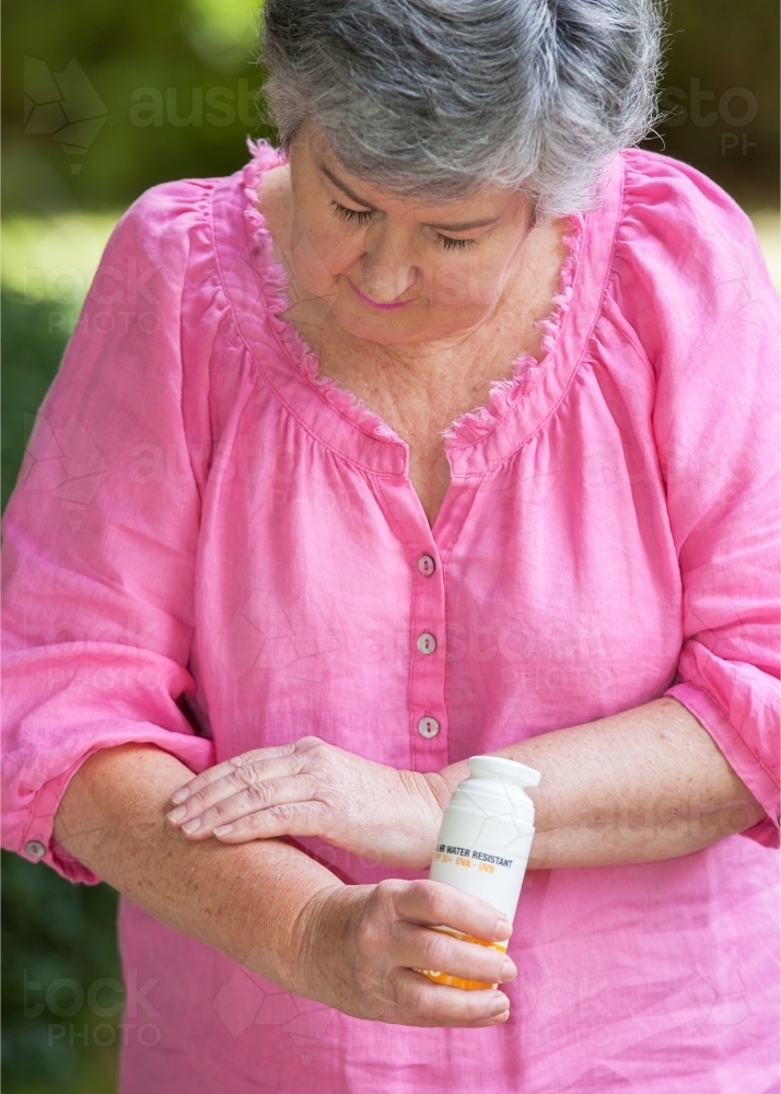 Woman applying sunscreen - Australian Stock Image