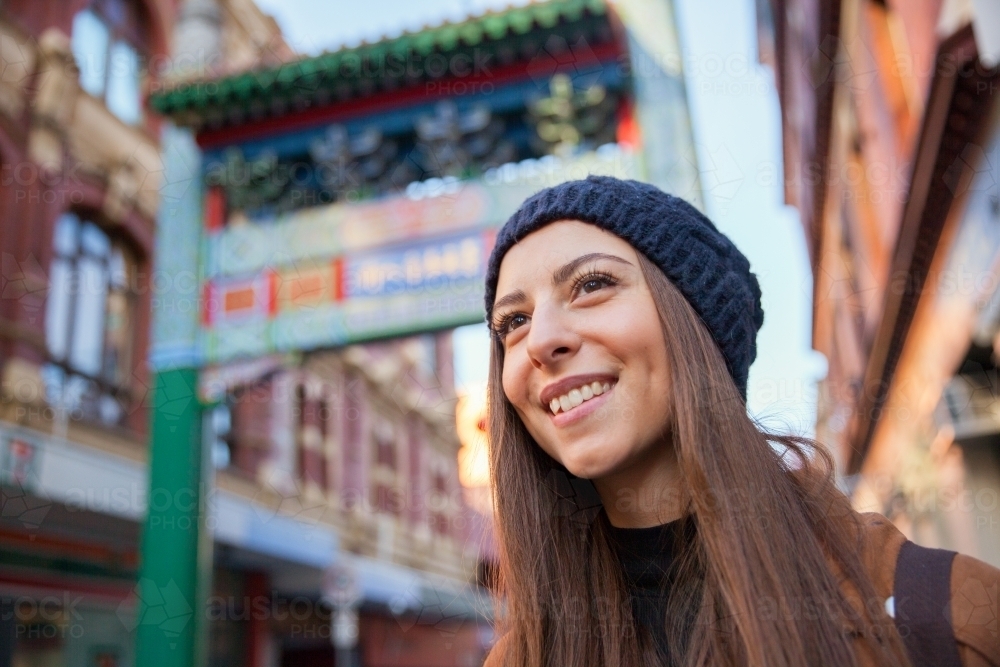 Woman at Entrance to Chinatown Melbourne - Australian Stock Image