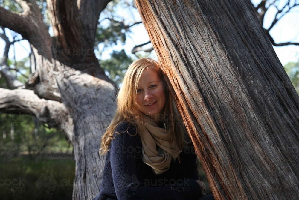 Woman beside tree - Australian Stock Image