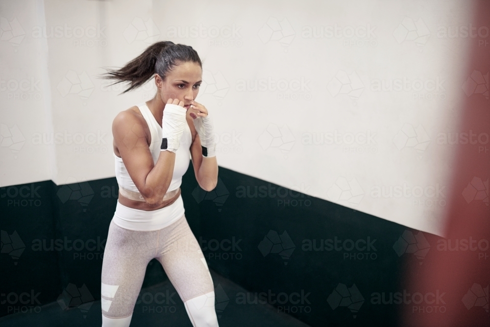 Woman boxing training at gym - Australian Stock Image