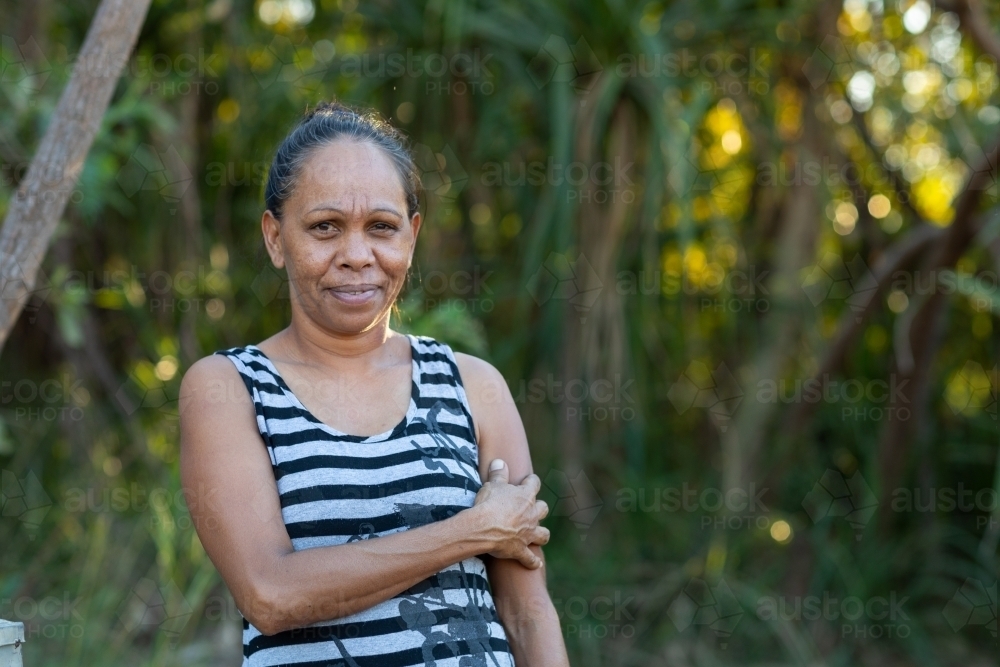 Woman by herself near lush vegetation - Australian Stock Image