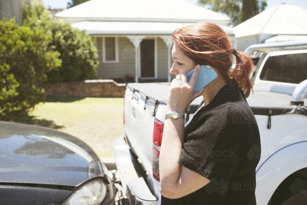 Woman calling for help at car accident - Australian Stock Image