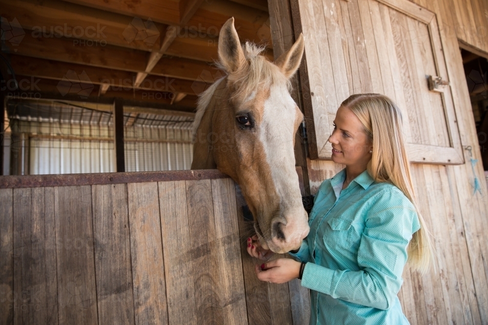 Woman Caring for Her Horse - Australian Stock Image