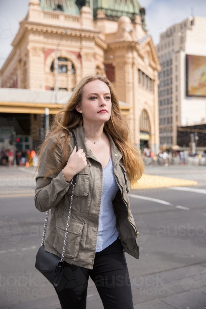 Woman crossing from the Station to Federation Square - Australian Stock Image
