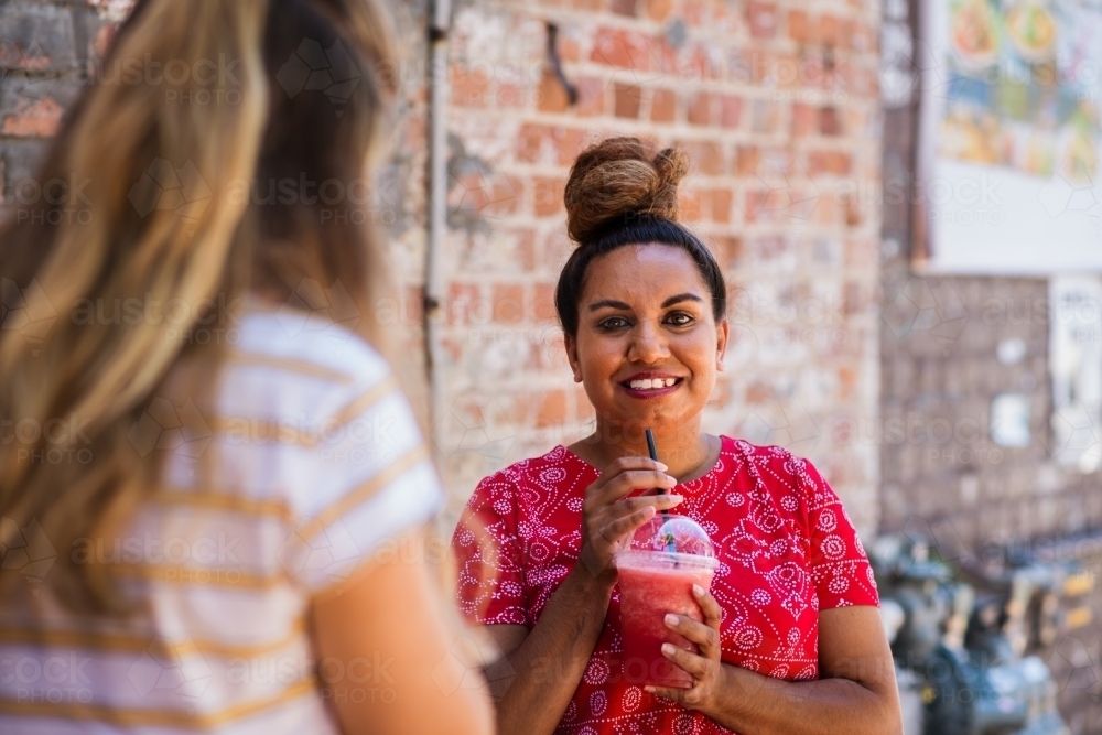woman drinking smoothie - Australian Stock Image