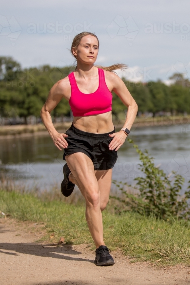 Woman exercising by the River - Australian Stock Image