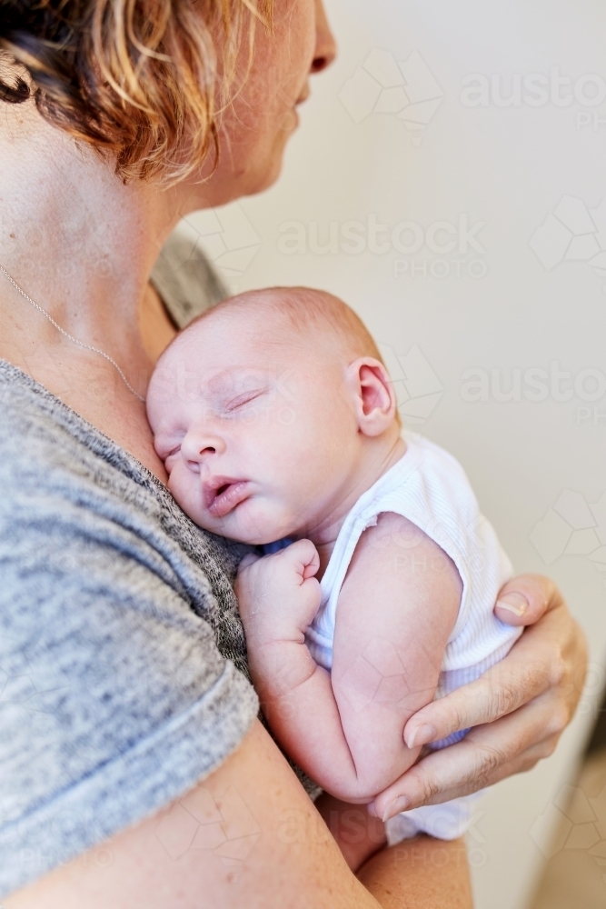 Woman holding newborn baby - Australian Stock Image