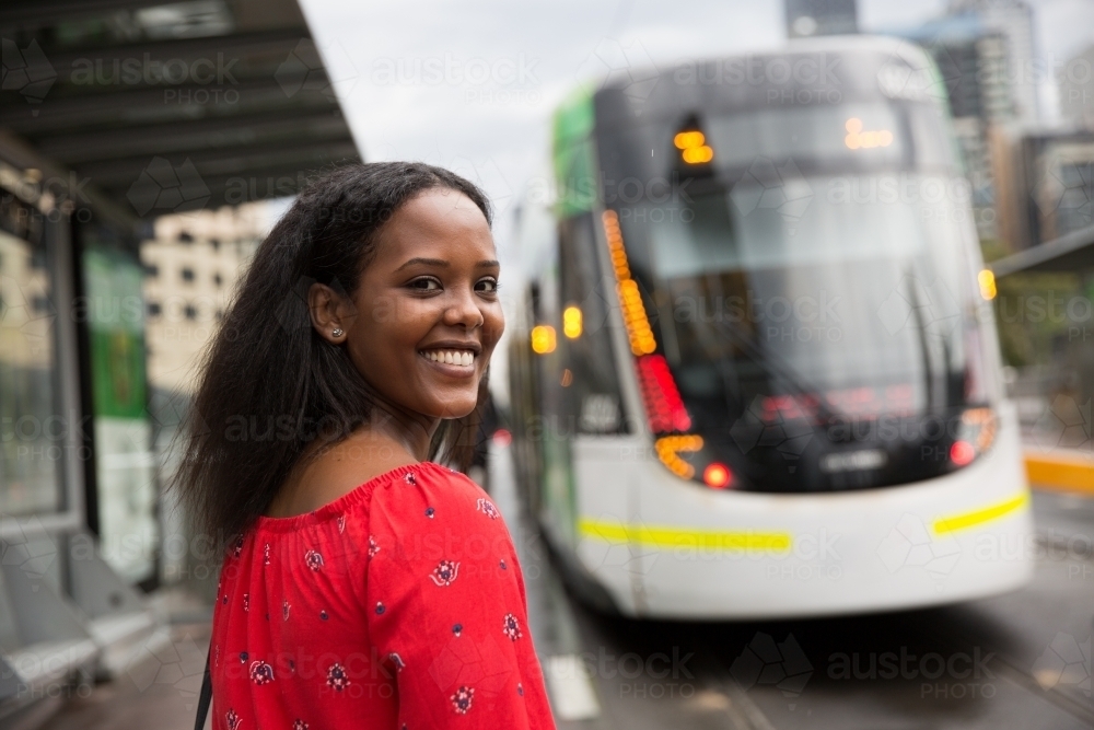 Woman Hurrying to Catch the Tram - Australian Stock Image