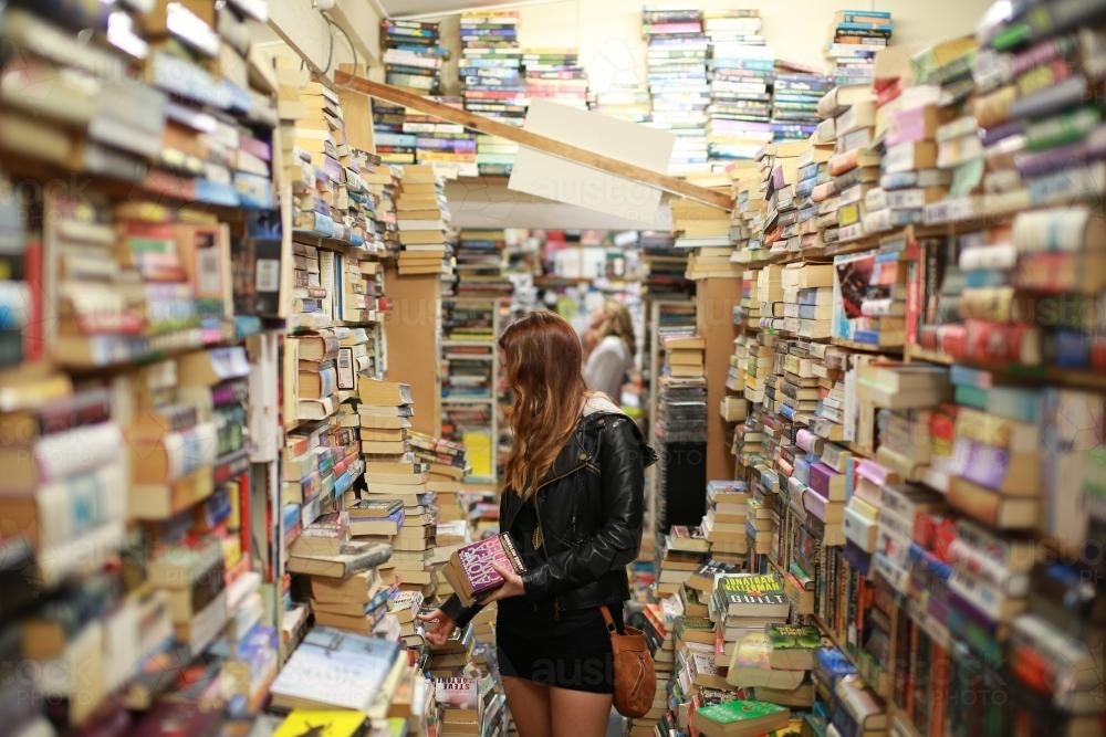 Woman in bookshop - Australian Stock Image