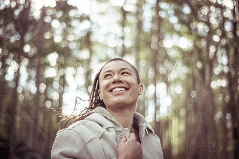 Woman laughing and dancing in the bush - Australian Stock Image