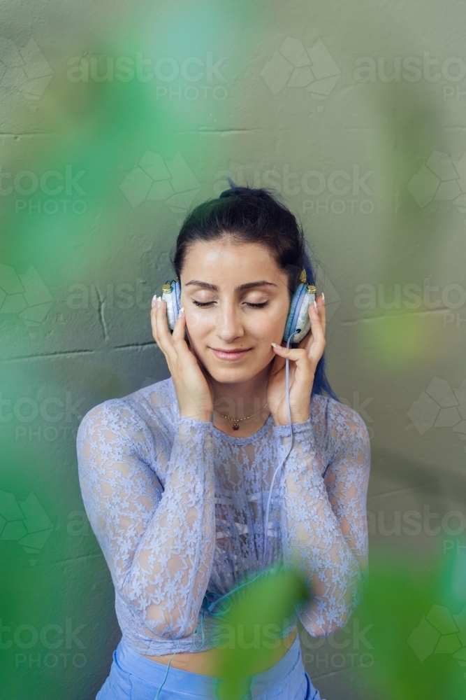 woman listening to music - Australian Stock Image