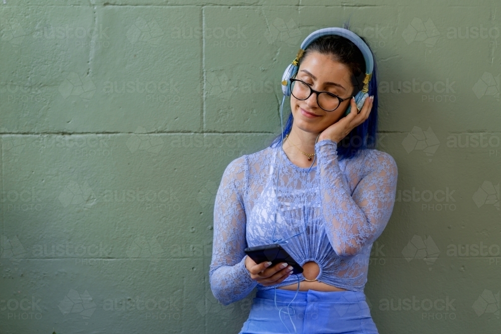 woman listening to music - Australian Stock Image