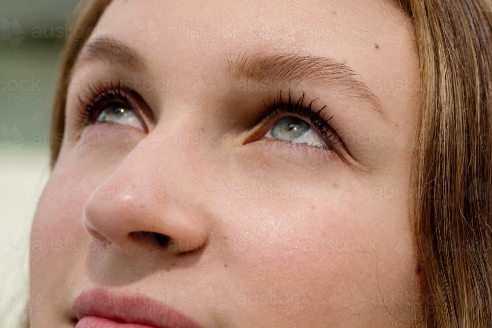 woman looking up, eye close up - Australian Stock Image