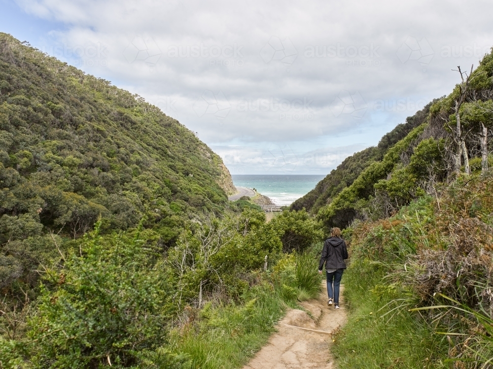 Woman on a walk at a coastal location - Australian Stock Image