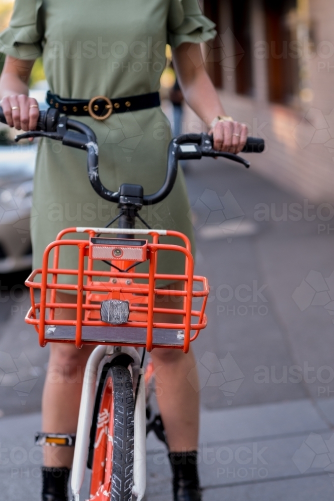 woman on council hire bike - Australian Stock Image