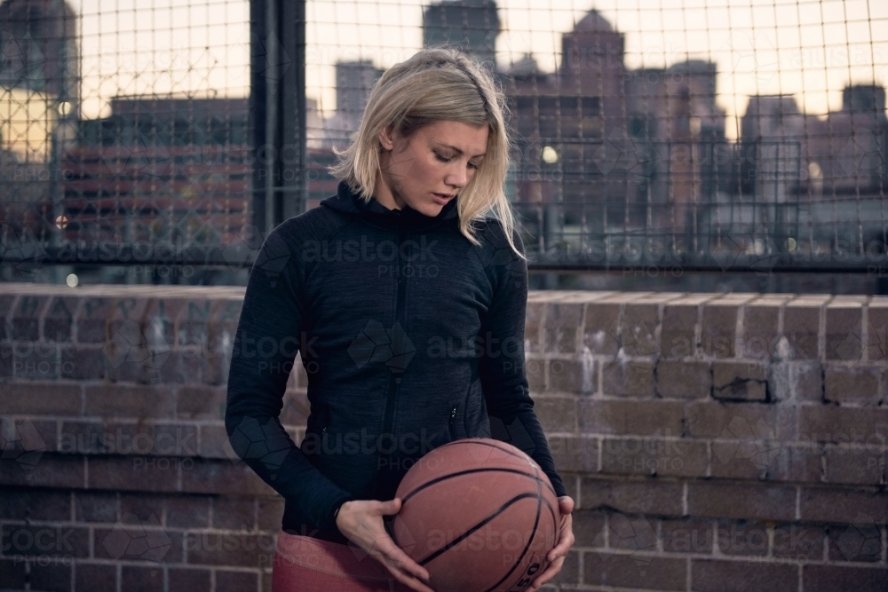 Woman portrait with basketball - Australian Stock Image