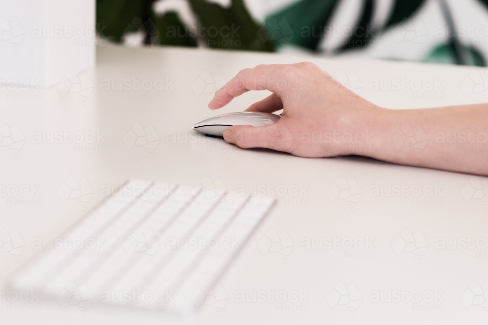 woman's hand on a mouse - Australian Stock Image