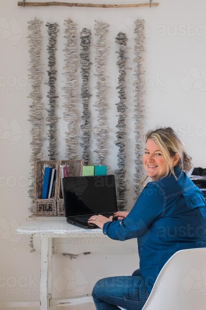 Woman using a laptop - Australian Stock Image