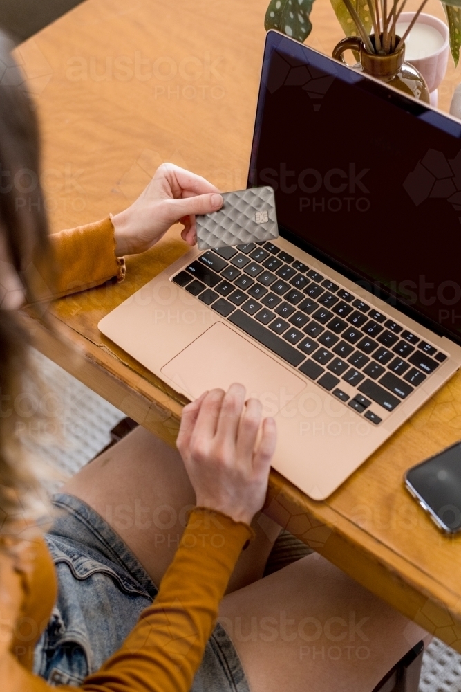 woman using credit card to shop online - Australian Stock Image
