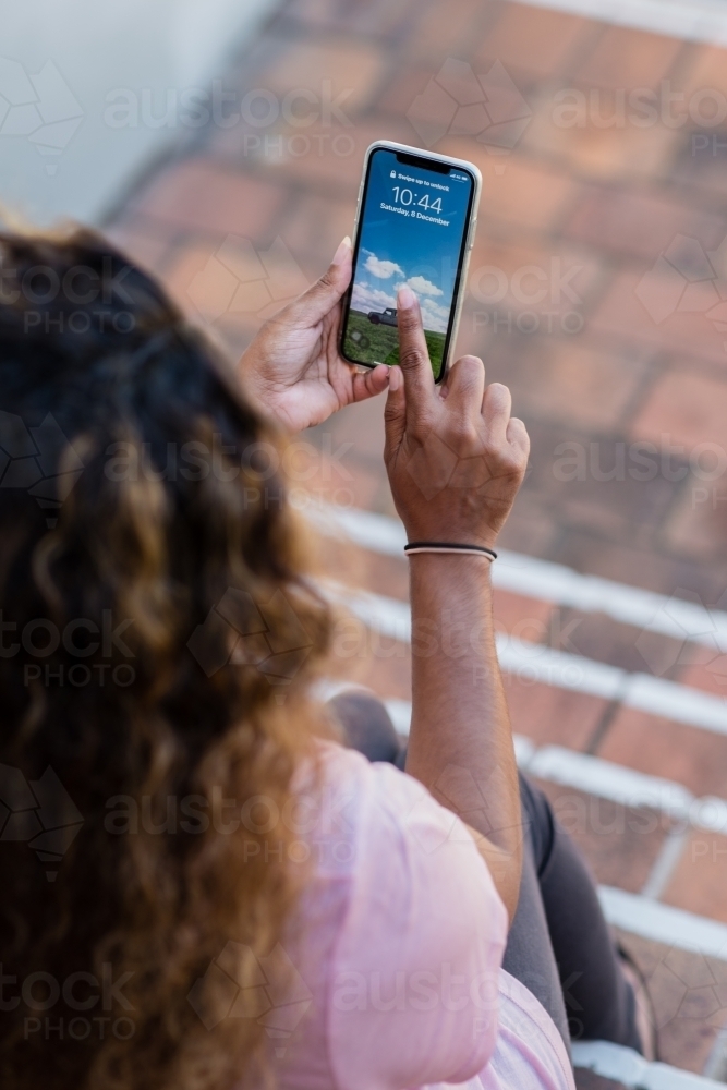 woman using mobile phone - Australian Stock Image