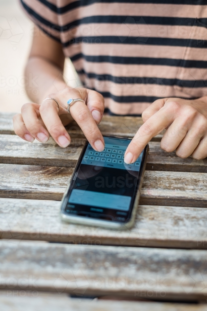 woman using mobile phone - Australian Stock Image