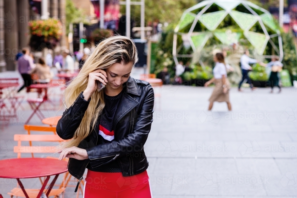 woman using phone in the city - Australian Stock Image