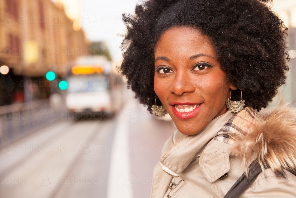 Woman Waiting for Melbourne Tram on Flinders Street - Australian Stock Image