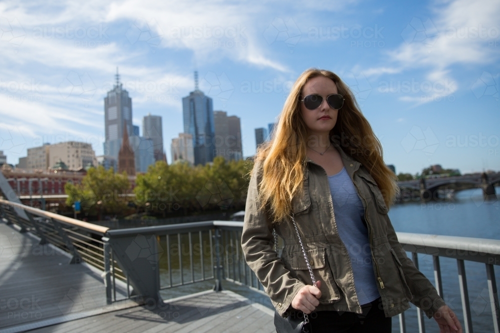 Woman Walking from Melbourne City to Southbank - Australian Stock Image