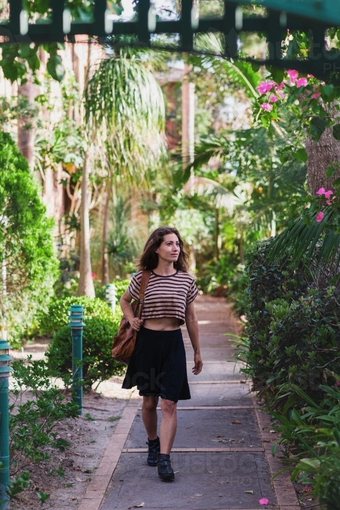 woman walking in garden - Australian Stock Image